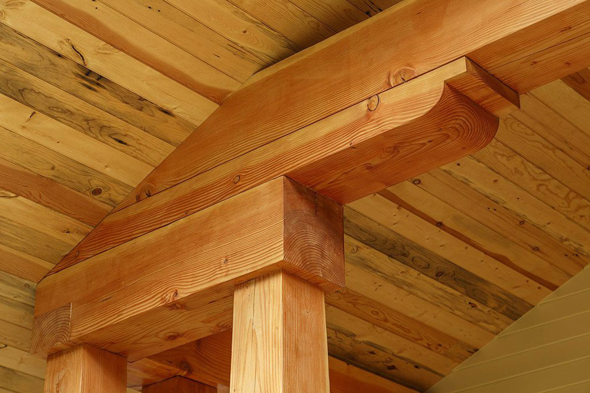 Close-up of wooden beam and ceiling in a craftsman-style home.