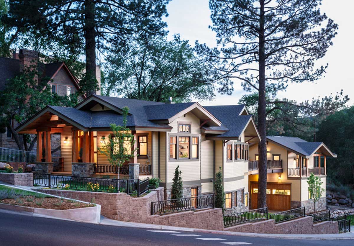 Elegant Craftsman-style house with detailed woodwork and large windows.