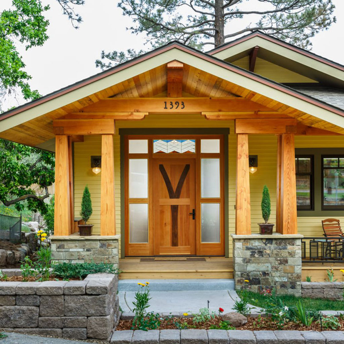 Charming Craftsman-style home with inviting front porch and natural wood accents.