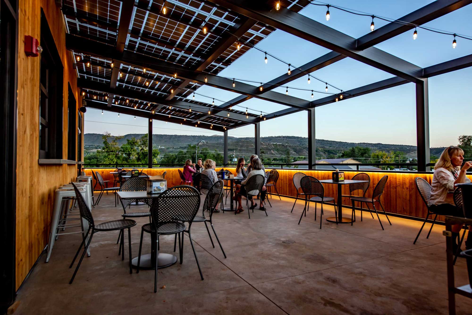Rooftop dining area at Zia Taqueria with scenic views and outdoor seating.