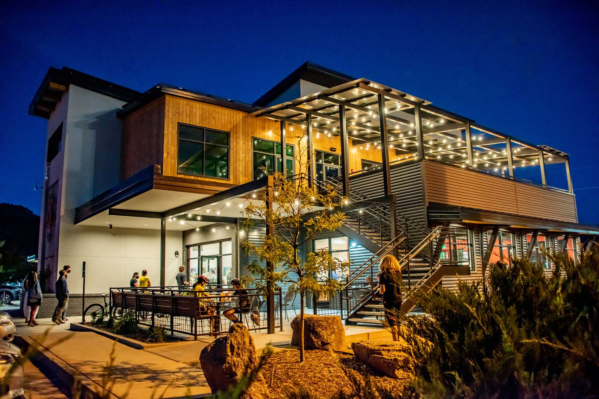 Modern Zia Taqueria building with outdoor seating and architectural lighting.