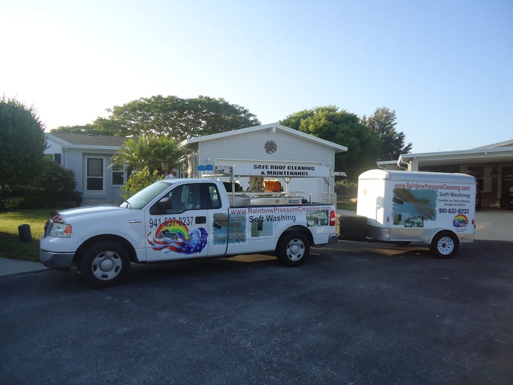 Rainbow Pressure Cleaning truck and trailer in a manufactured home park in Punta Gorda Florida