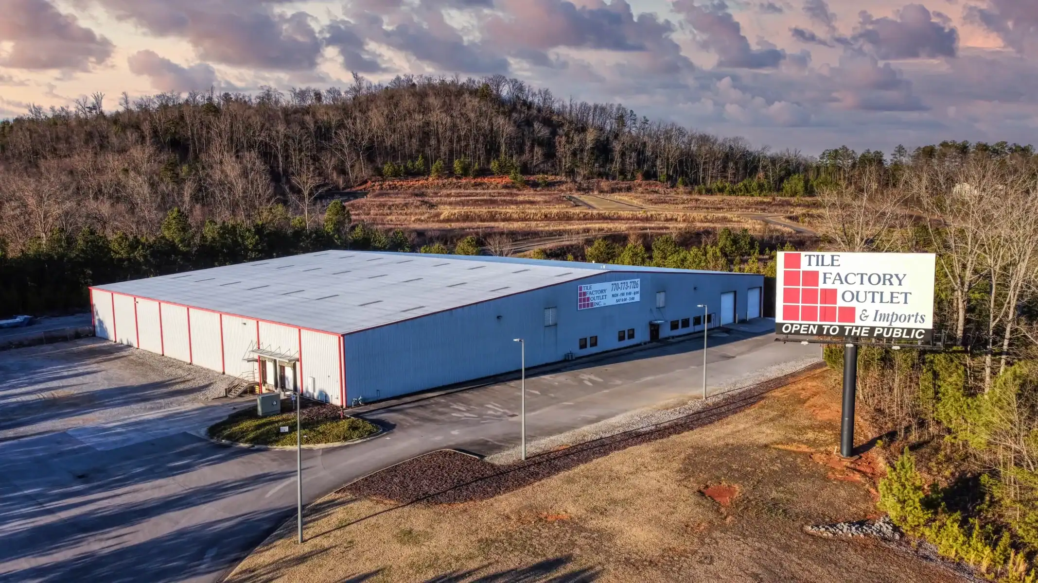 Tile Factory Outlet building in Northwest, GA with open parking lot.