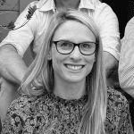 View of a smiling woman with blonde hair and glasses, representative of rehabilitation and mental health support at Rehab Taranaki.
