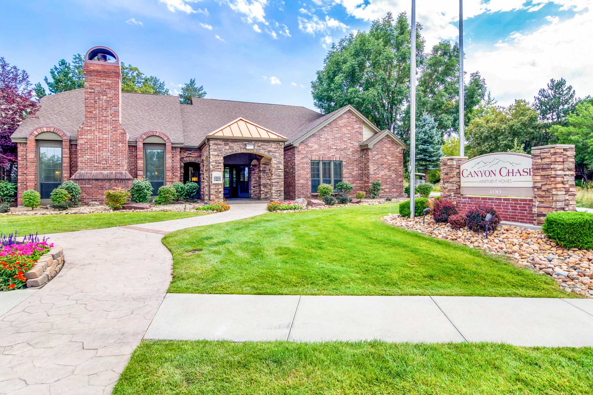 The entrance at Canyon Chase apartments in Westminster, CO.
