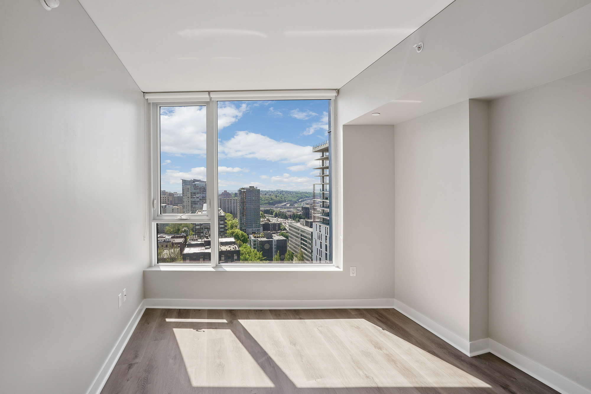A bedroom in a Cielo luxury apartment in downtown Seattle.