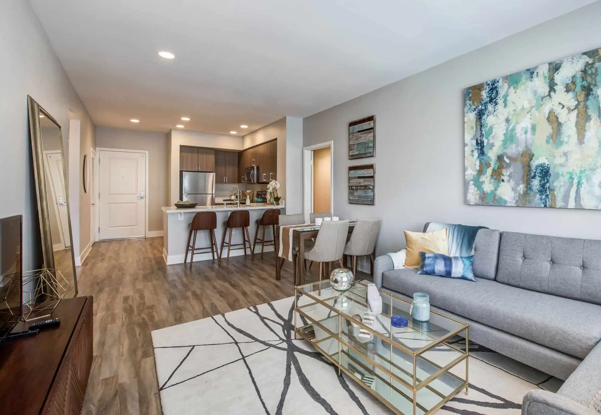 The living room and kitchen in an Alder apartment in Northridge, CA.