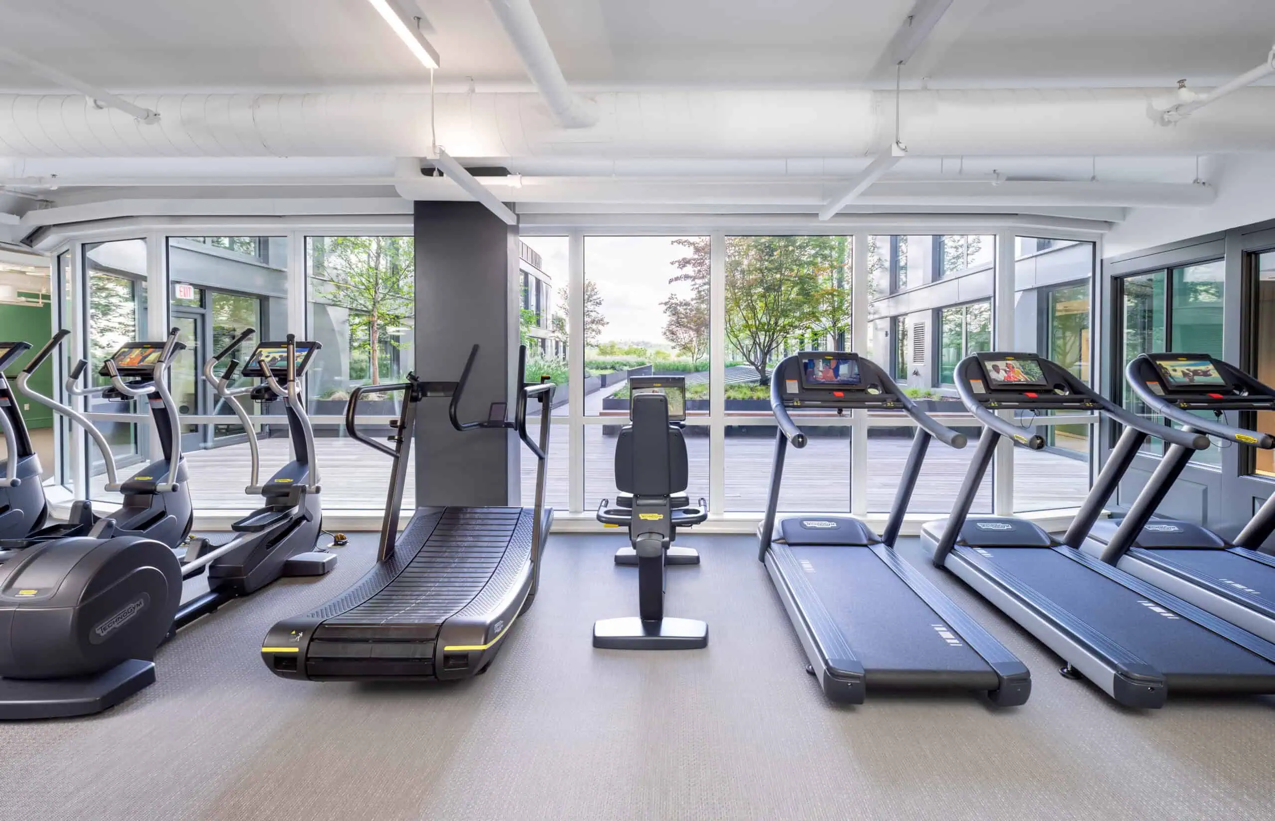 ellipticals and treadmills in apartment building fitness center