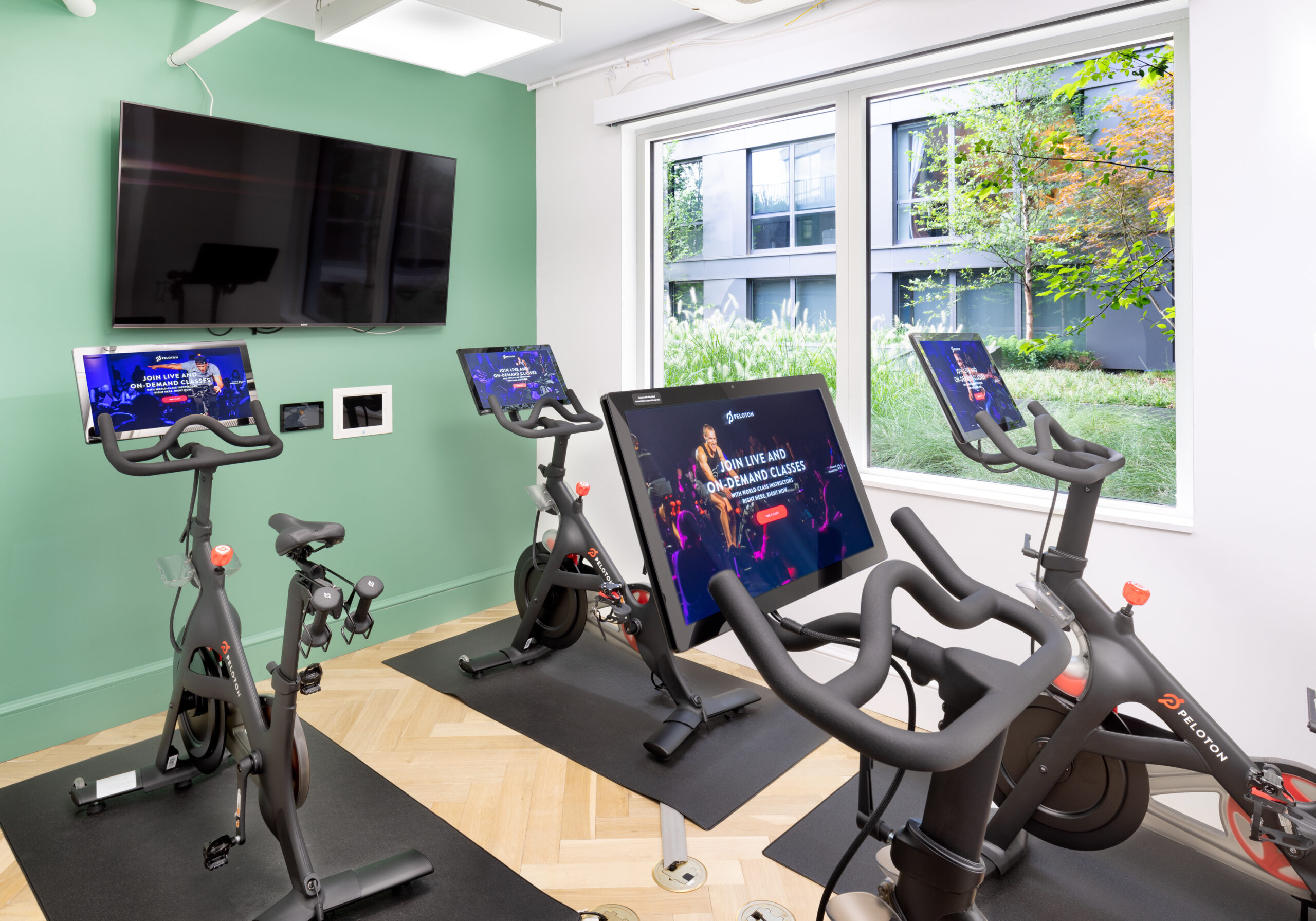 Peleton bikes in apartment building fitness center