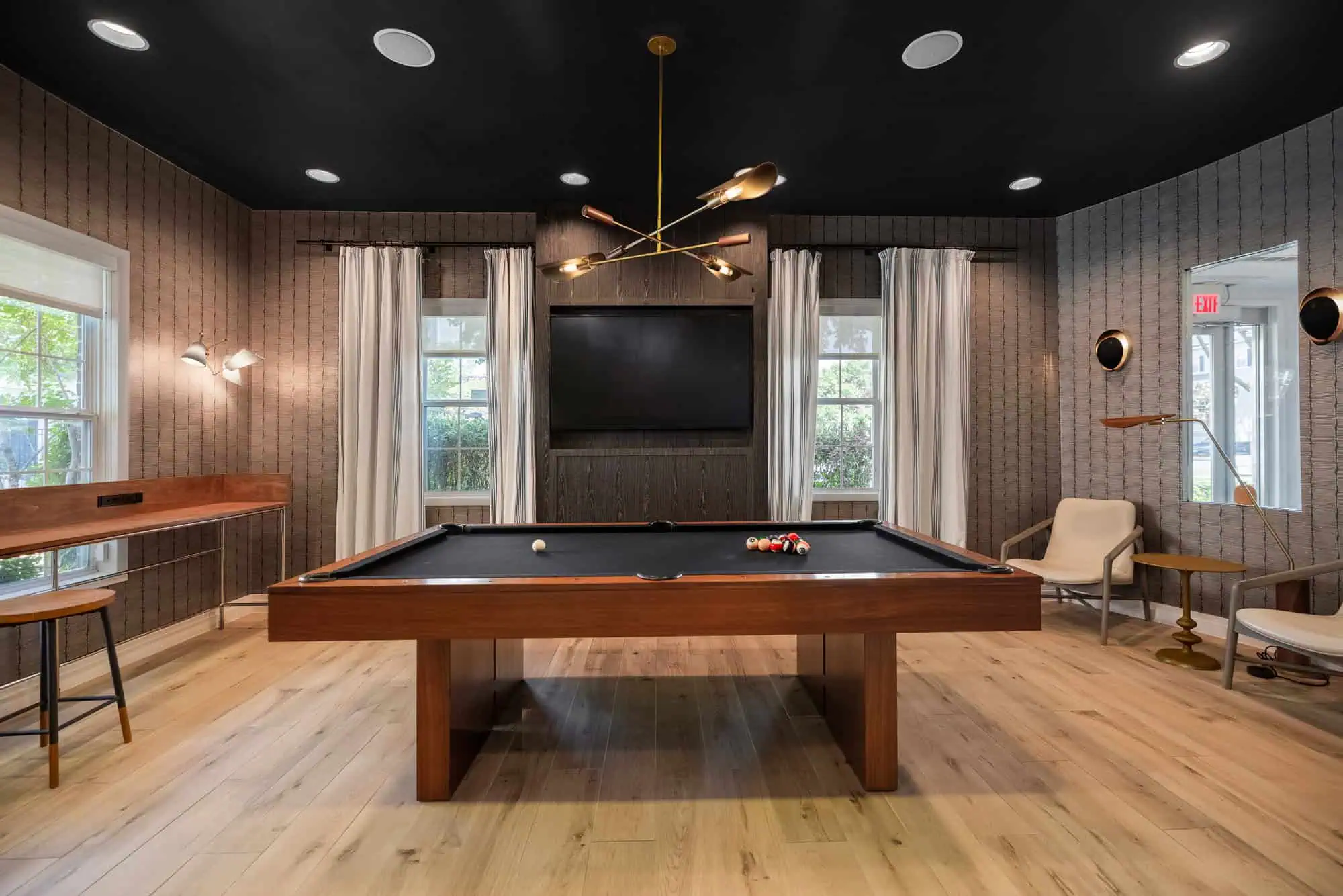 Resident lounge with billiards and seating options.
