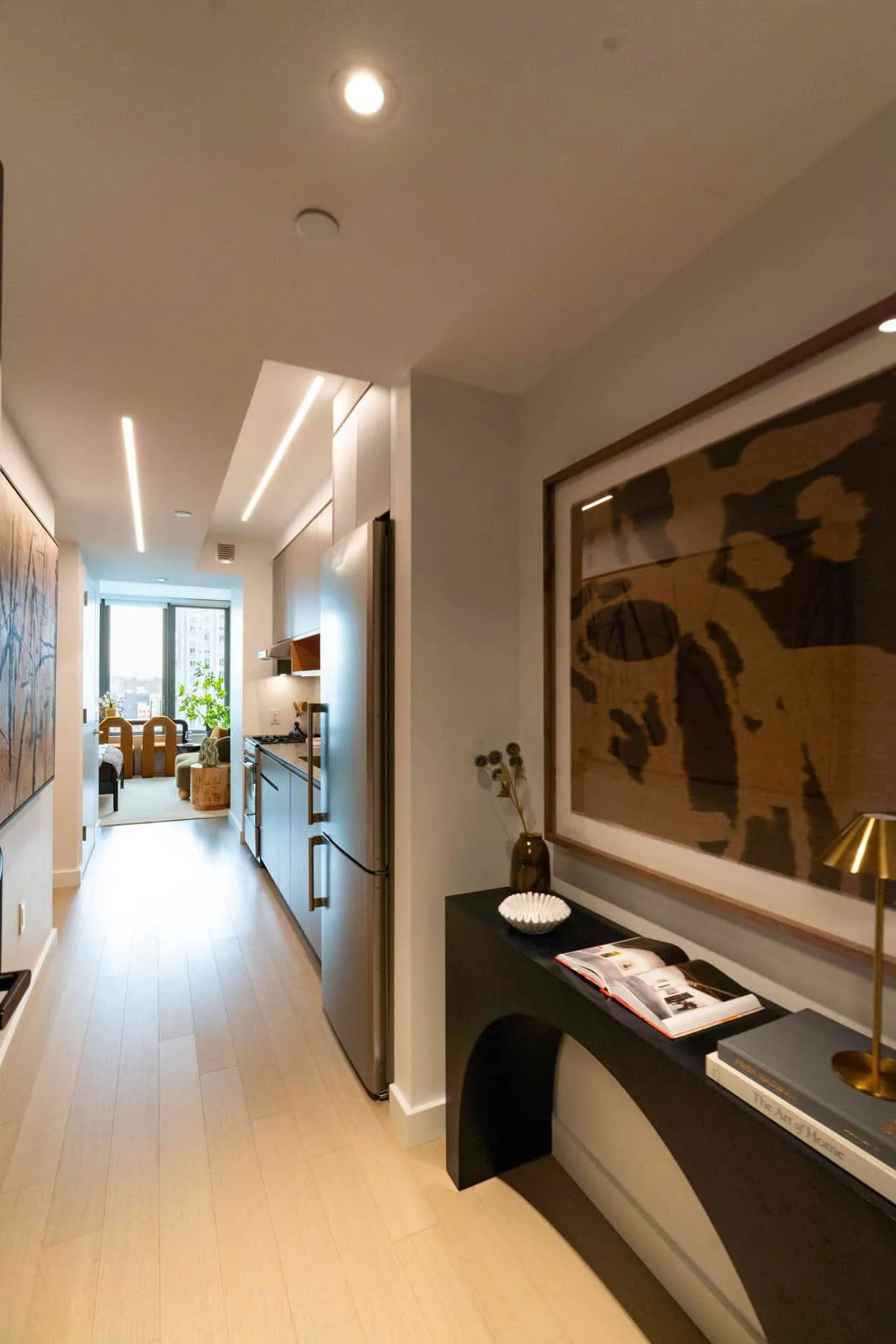 A hallway with a large painting on the wall.