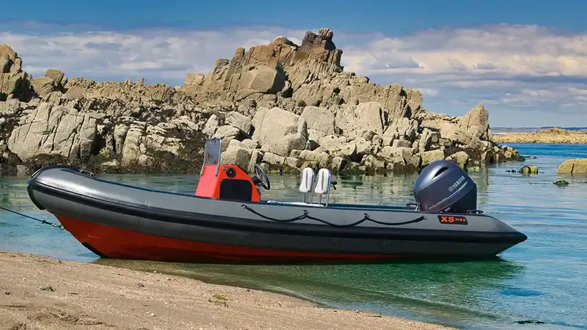 What is a Rigid Inflatable Boat (RIB) Definition of a Rigid Inflatable Boat (RIB) showing its rigid hull, inflatable tubes, and engine @ RIBs ONLY - Home of the Rigid Inflatable Boat