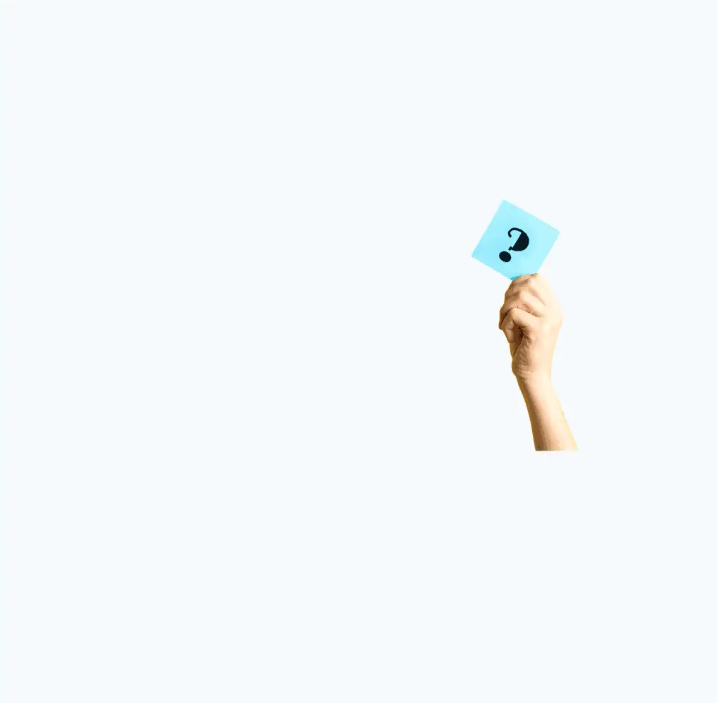 A hand holding a Post-it note with a question mark drawn on it