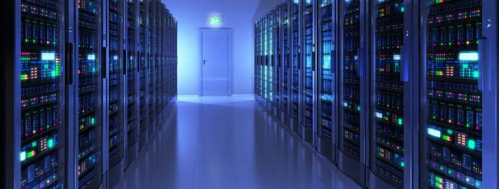 Two walls of computer servers lining both sides of a room
