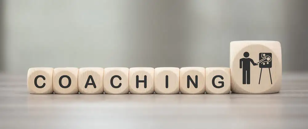 Coaching written out with wooden blocks