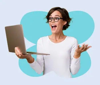 A woman holding a laptop and looking surprised