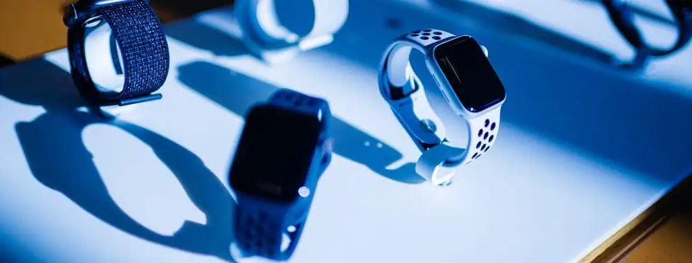 A display of Apple smart watches on a table