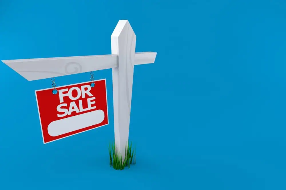For Sale sign outside a house