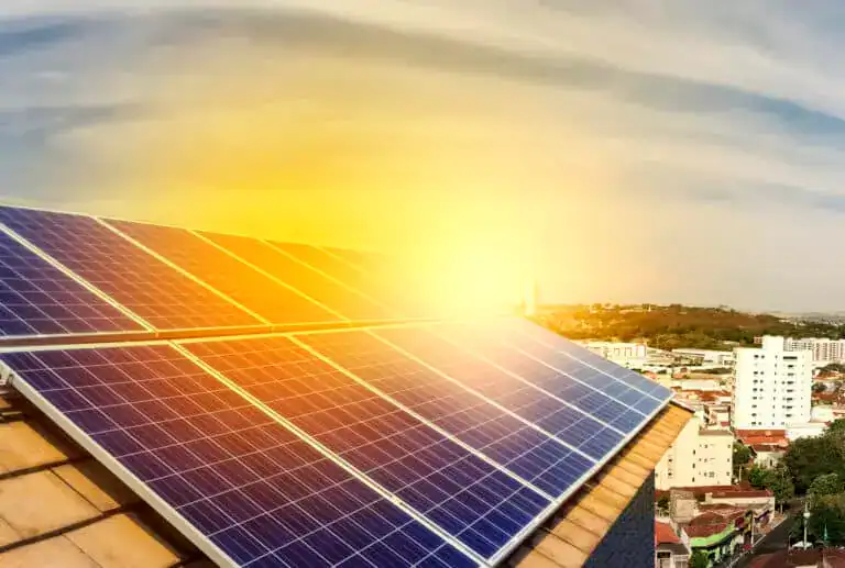 Photovoltaic power plant installation on the roof of a residential building on sunny day