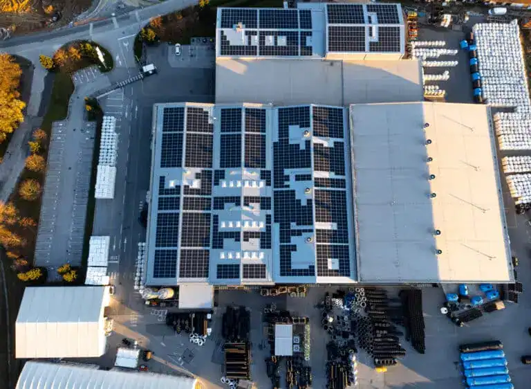 Factory building with large array of solar panels on the roof