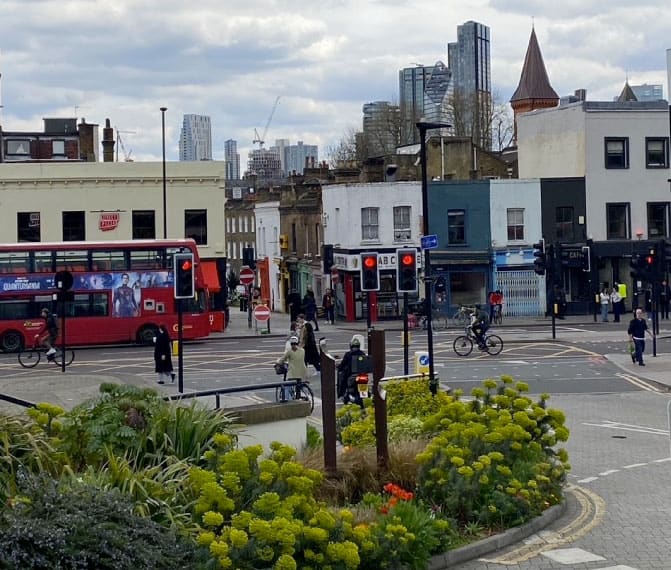 London street city with red bus in road