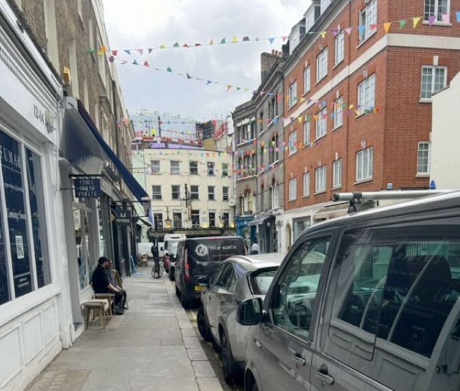 View along a central London streets with shops at ground level and residential accommodation above
