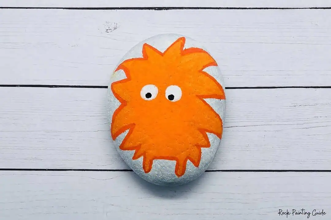 Easy Monster Rock Painting Tutorial: Fuzzy Halloween Rocks 6 paint eyes on the orange monster rock painting