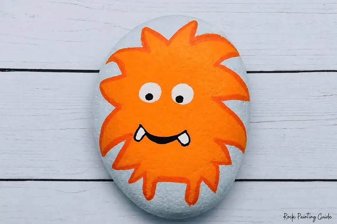 Easy Monster Rock Painting Tutorial: Fuzzy Halloween Rocks 7 draw mouth and teeth on monster rock painting