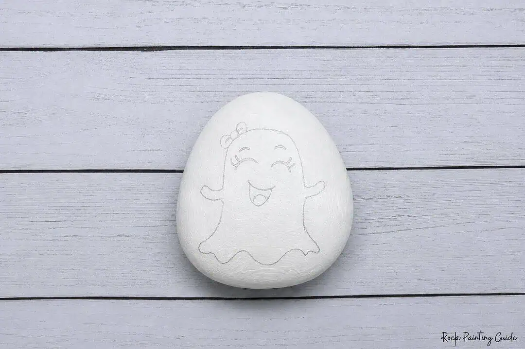 Easy Ghost Painted Rocks: Cute Ghost Emoji Rock Painting Tutorial 5 pencil sketch of a ghost with a bow on her head painted white rock