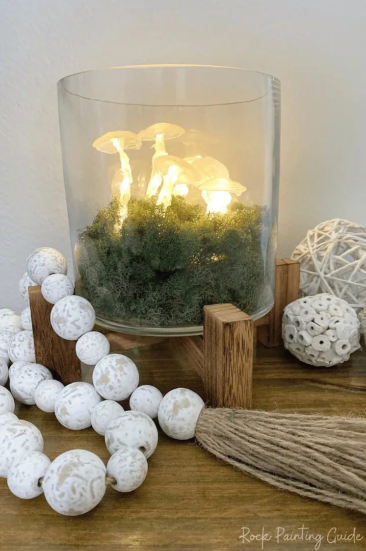 Easy DIY Mushroom Lights with Just Hot Glue and Fairy Lights! 10 diy mushroom fairy lights displayed in a clear glass vase