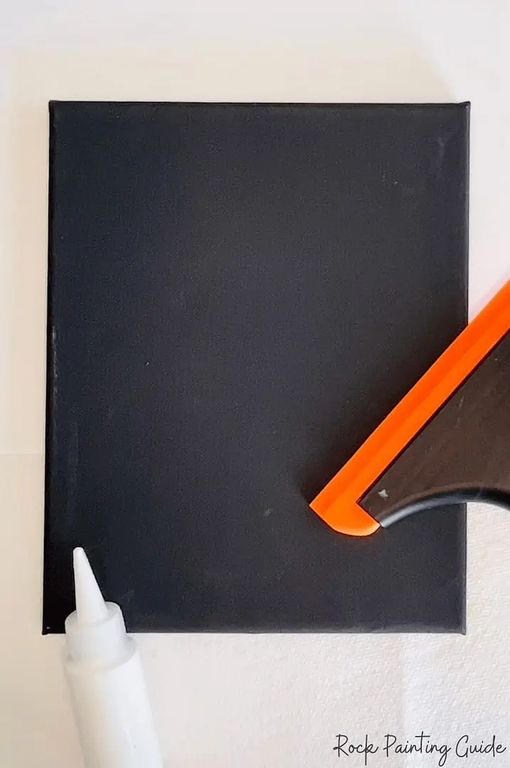 Halloween Squeegee Art: Easy Ghost Painting Craft 4 squeegee tool, white paint and black canvas