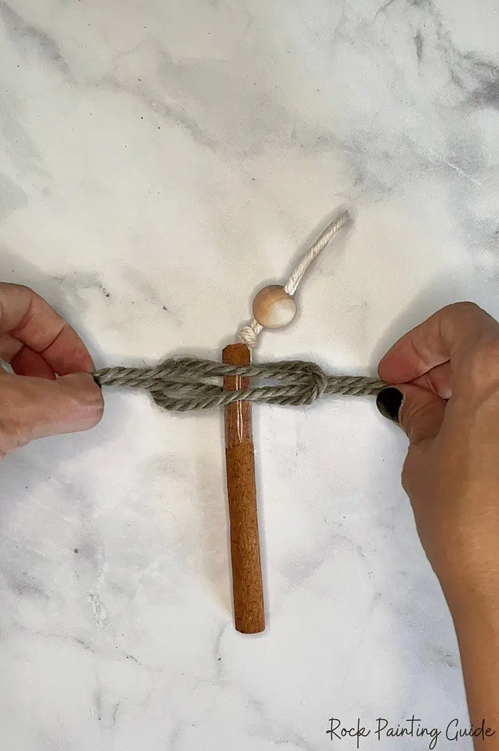 Perfect Macrame Christmas Trees Craft for Teens to try this Season 9 Place another yarn strand folded in half and place on top of the cinnamon stick.