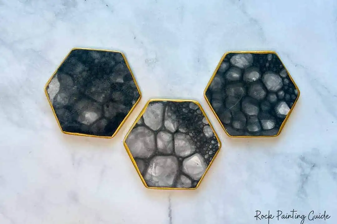 Make Stunning DIY Coasters with Bubble Painting Magic! 9 bubble painted diy coasters with gold boarder.