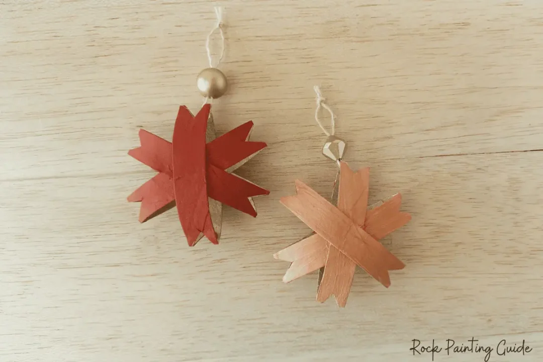 DIY Christmas Star Ornaments: A Fun Holiday Craft for Kids 11 two ornaments on a table