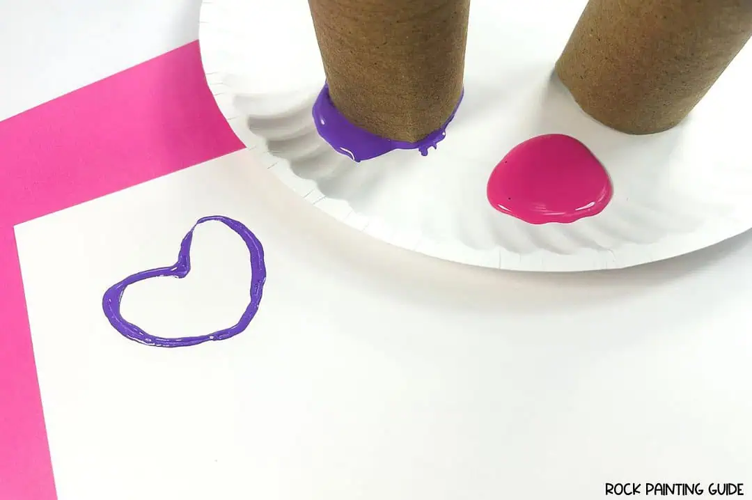 Create Valentine’s Day Fun with DIY Heart Stamp Craft 8 a paper plate with paint on it and a couple of rolls on it