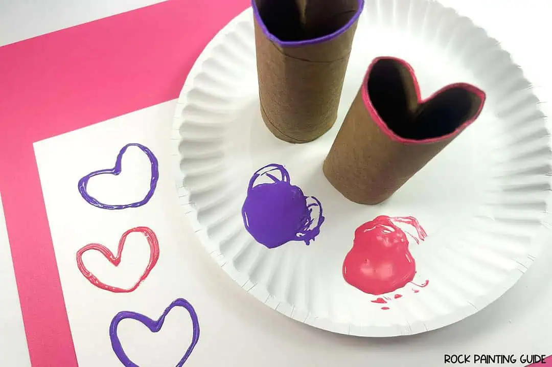 Create Valentine’s Day Fun with DIY Heart Stamp Craft 9 a paper plate with a couple of toilet paper rolls and paint on it