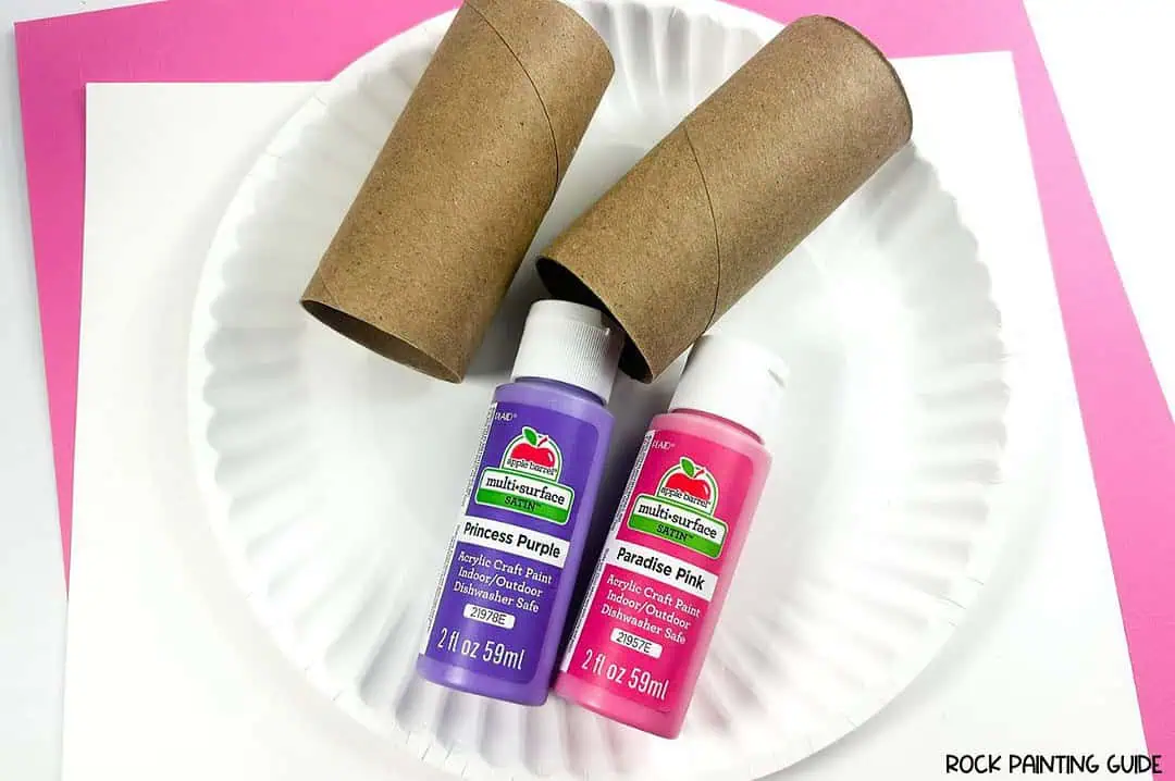 Create Valentine’s Day Fun with DIY Heart Stamp Craft 4 a paper plate with toilet paper rolls and bottles