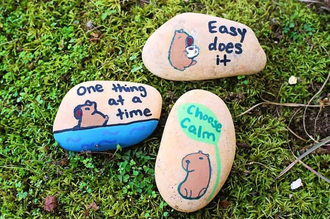 Create Capybara Painted Rocks for effortless Slow Living 3 capybara painted rocks lying in moss