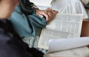 People reading the Bible during church service at Rolling Hills Community Church.