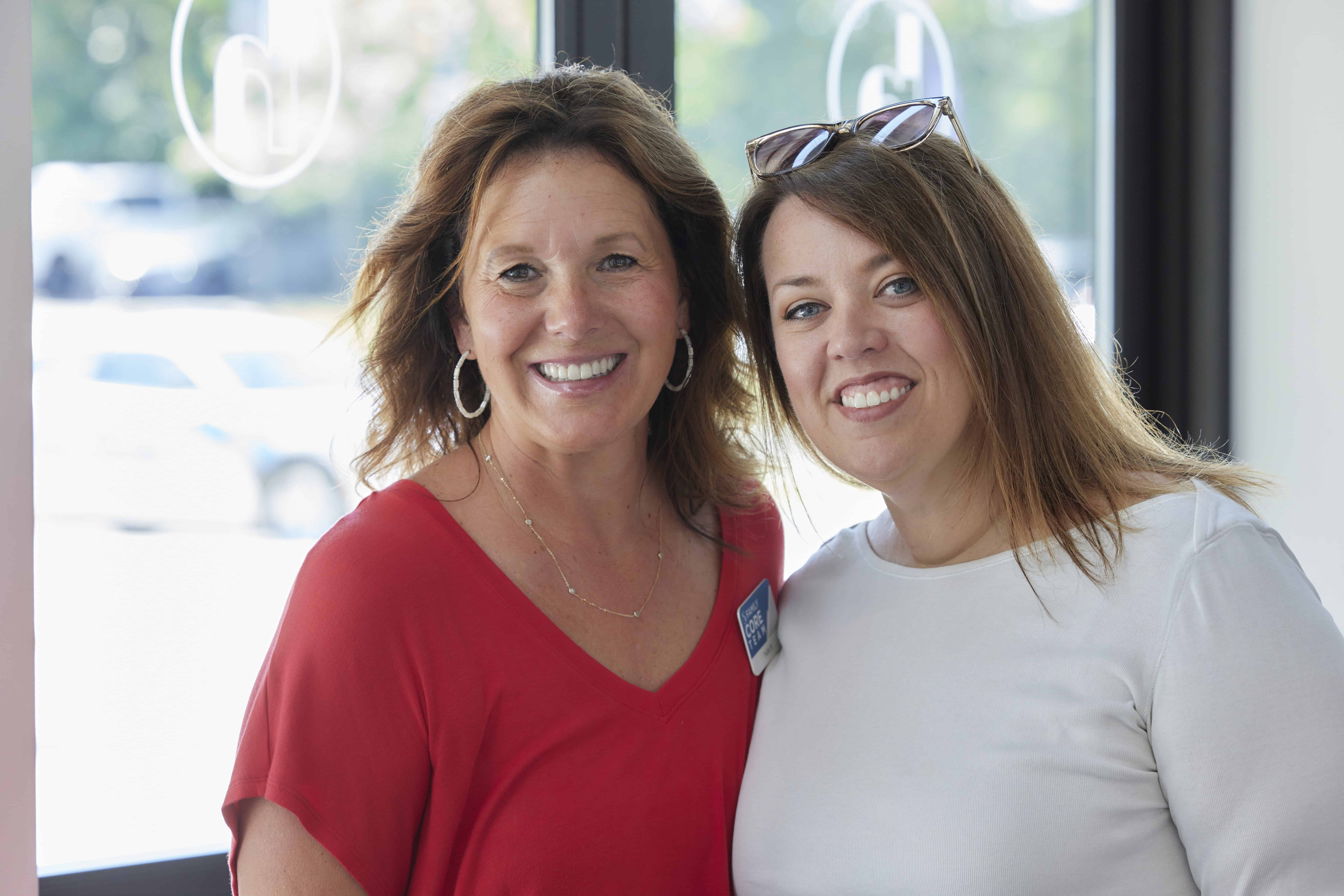 Two women smiling at Rolling Hills Community Church, community event.