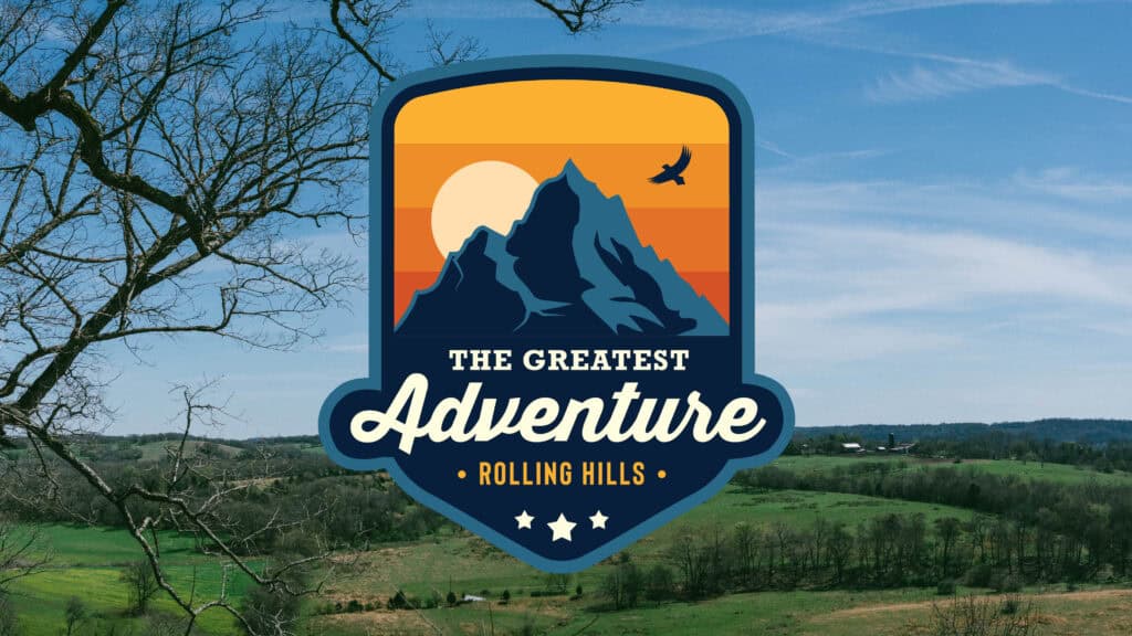 Logo of Rolling Hills Community Church with mountain and sunset design.
