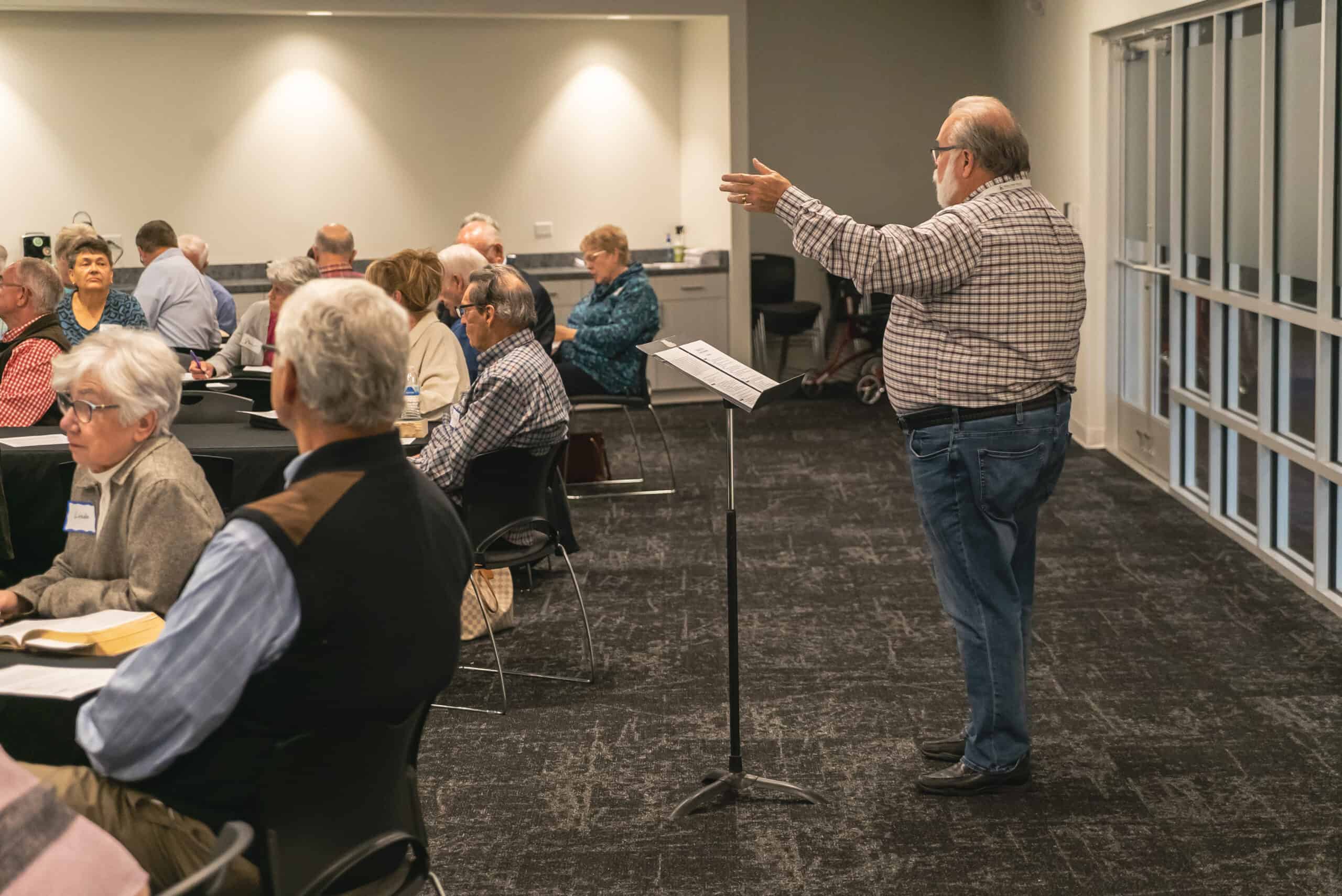 Pastor speaking to engaged congregation during service at Rolling Hills Community Church.