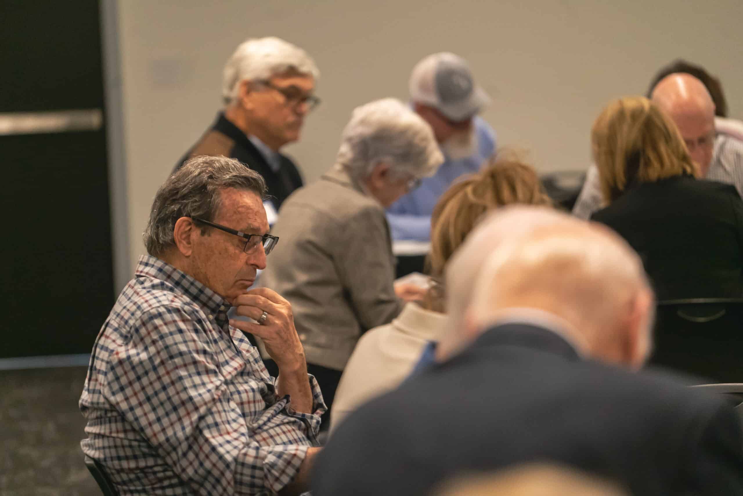 Group of diverse adults attending a church event at Rolling Hills Community Church.