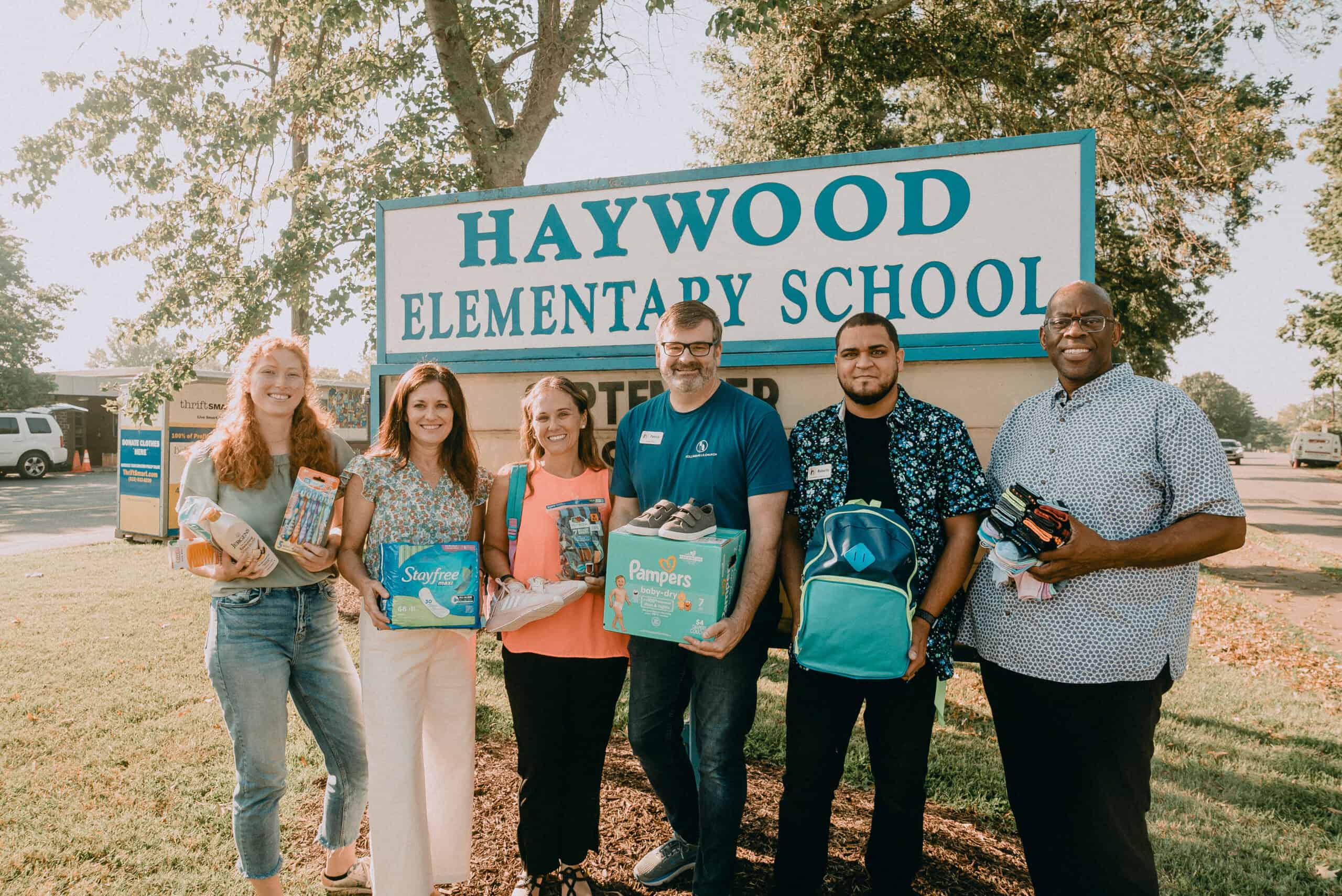 Group of diverse students and teachers at Haywood Elementary School.