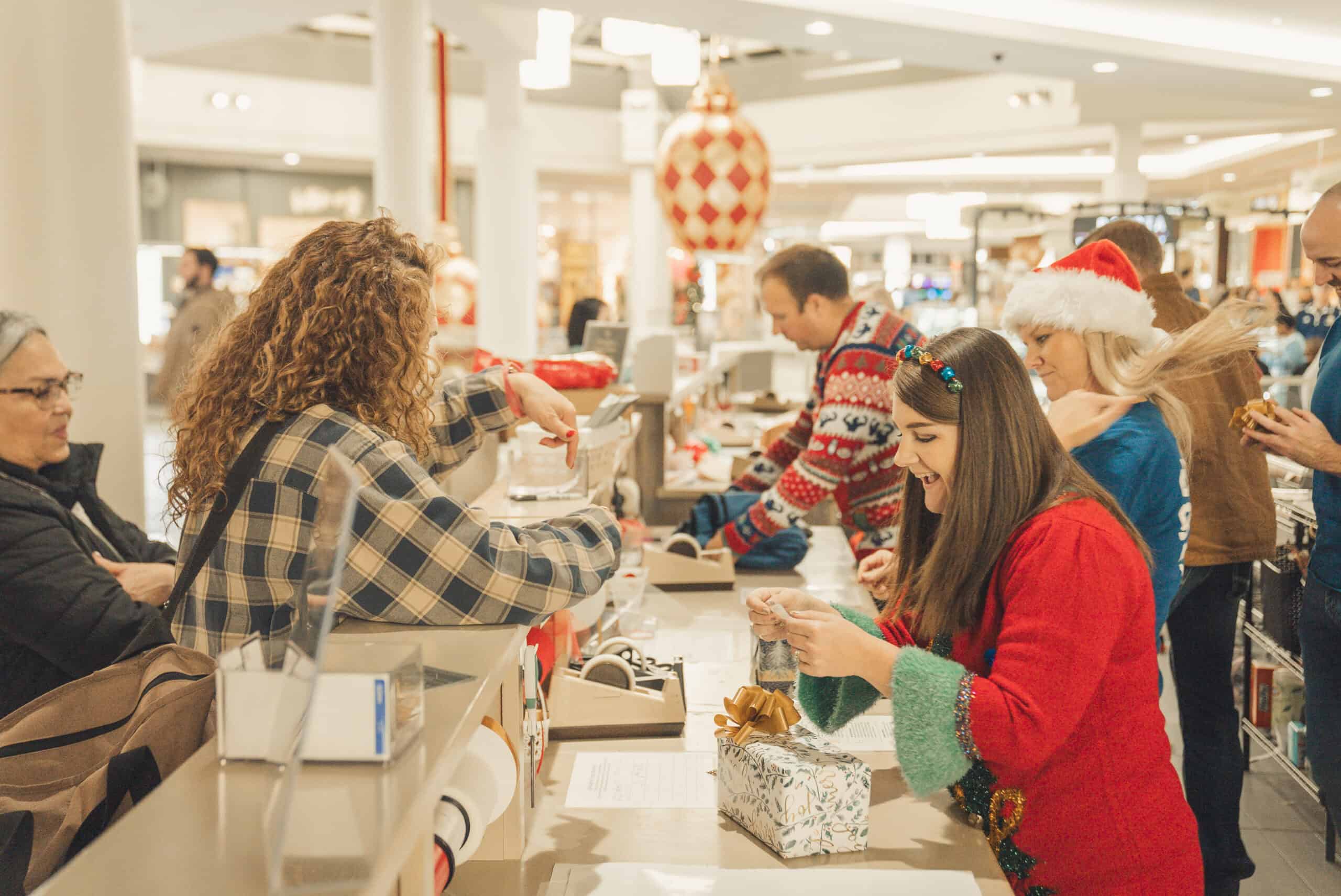 People shopping at Christmas event in Rolling Hills Community Church store.