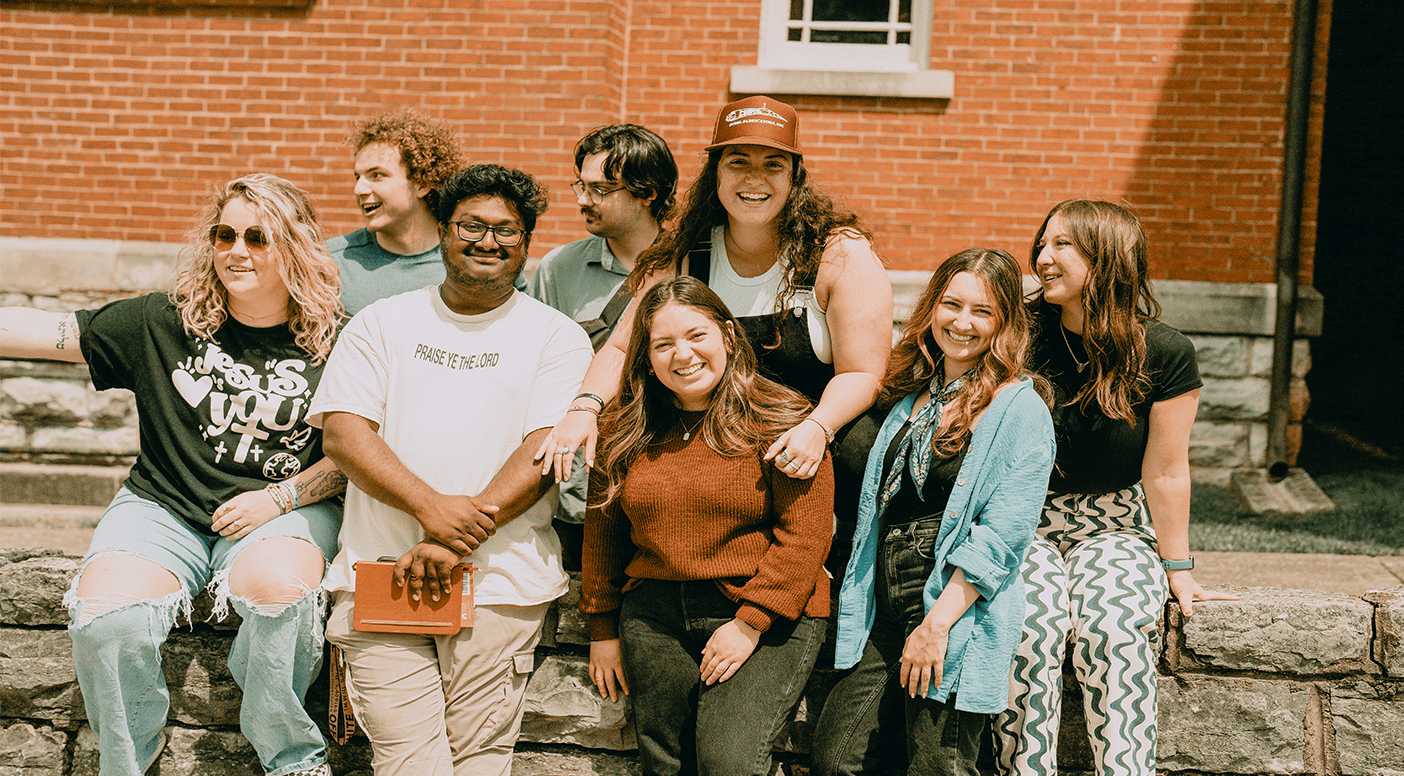 Community group at Rolling Hills Community Church, diverse members smiling outdoors.