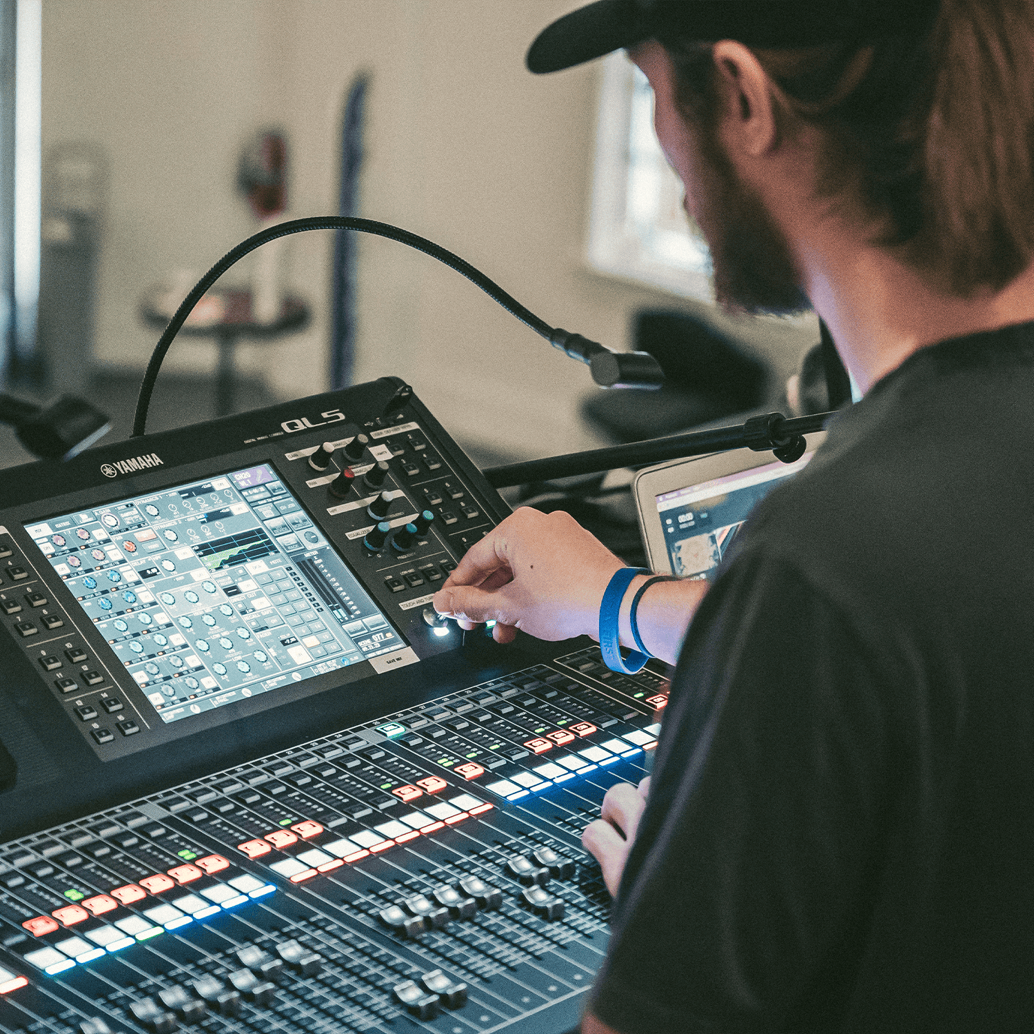 Music producer working with digital audio workstation at Rolling Hills Church.