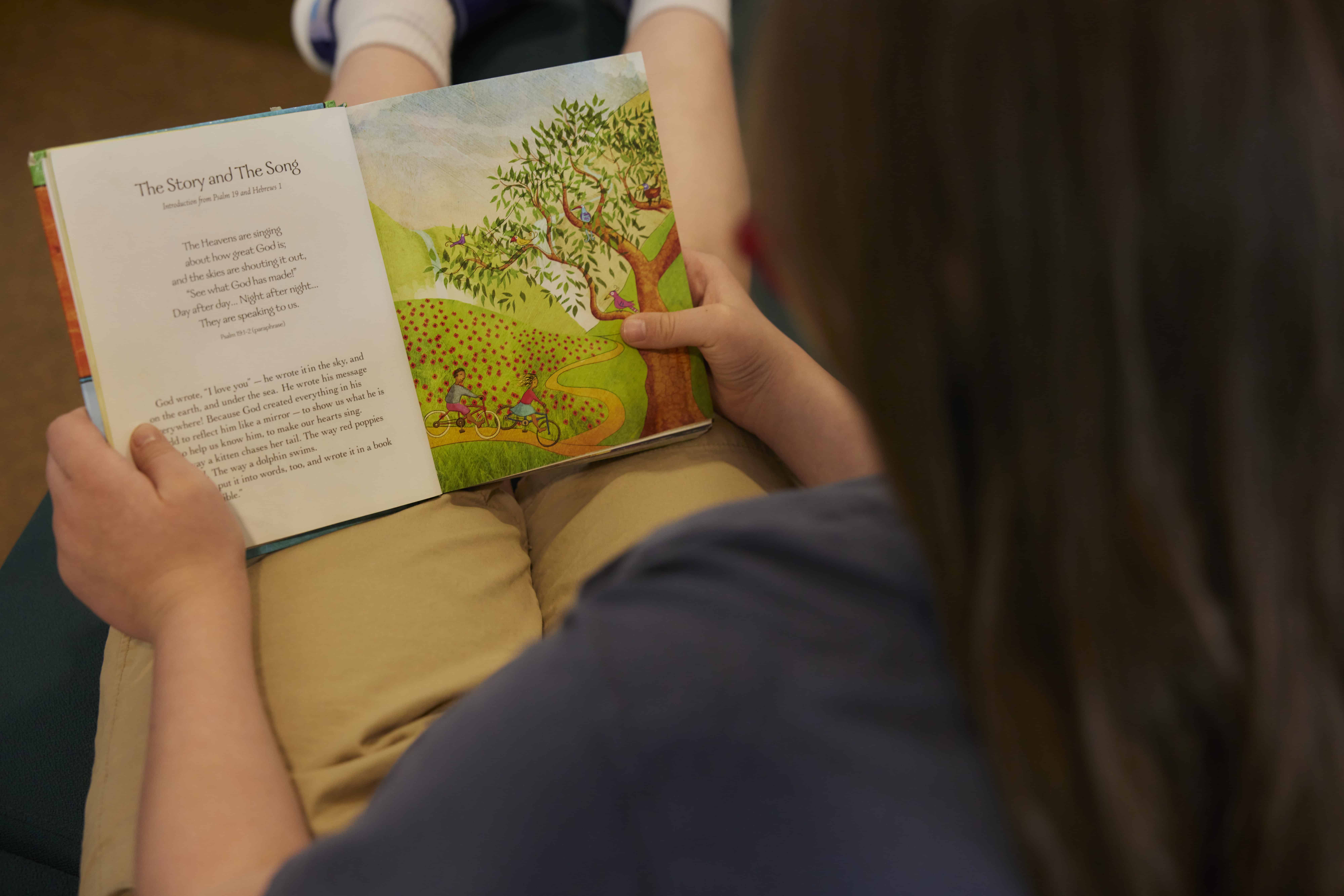 Person reading a children's storybook during a church event at Rolling Hills Community Church.