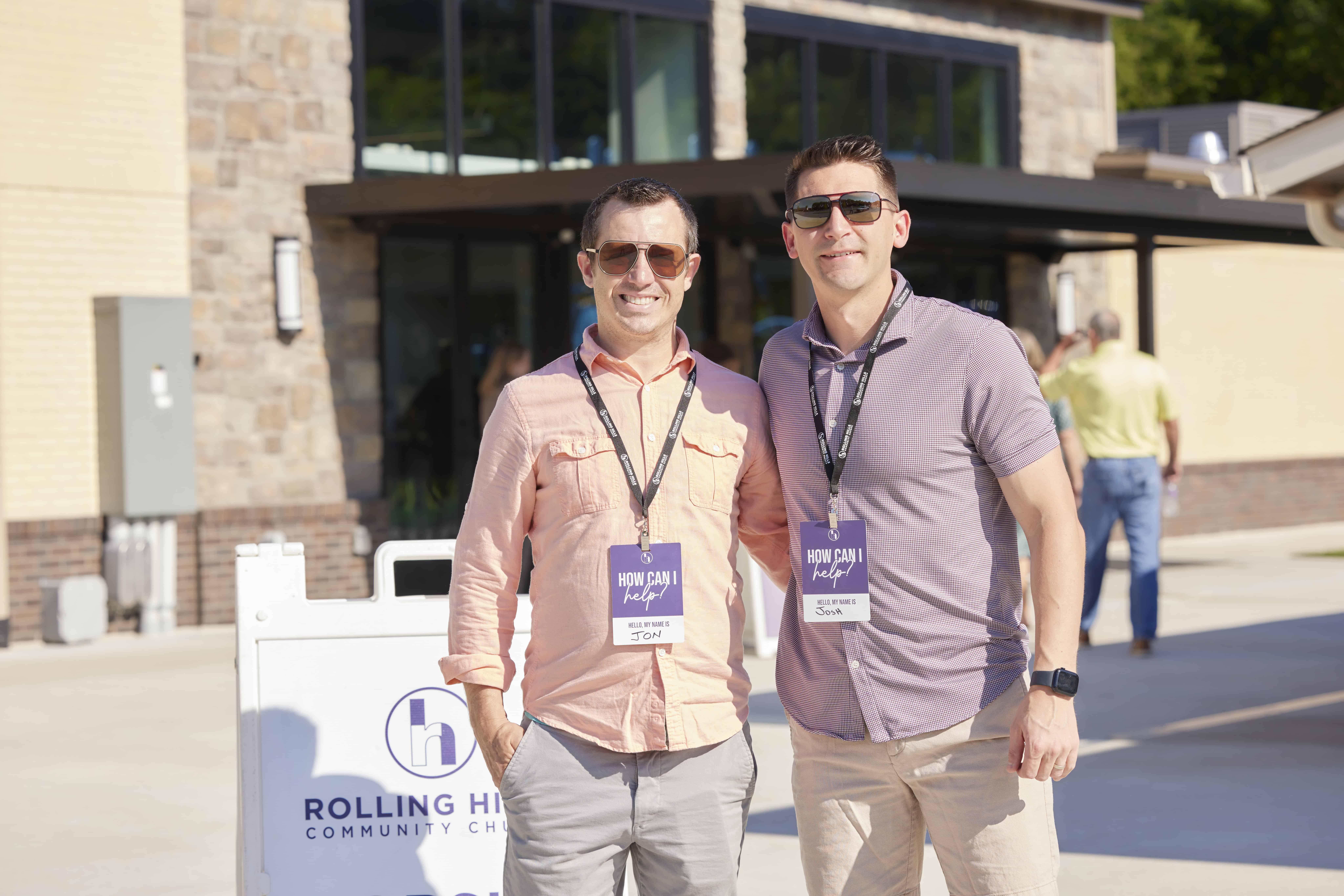 Two men smiling at Rolling Hills Community Church outdoor event.