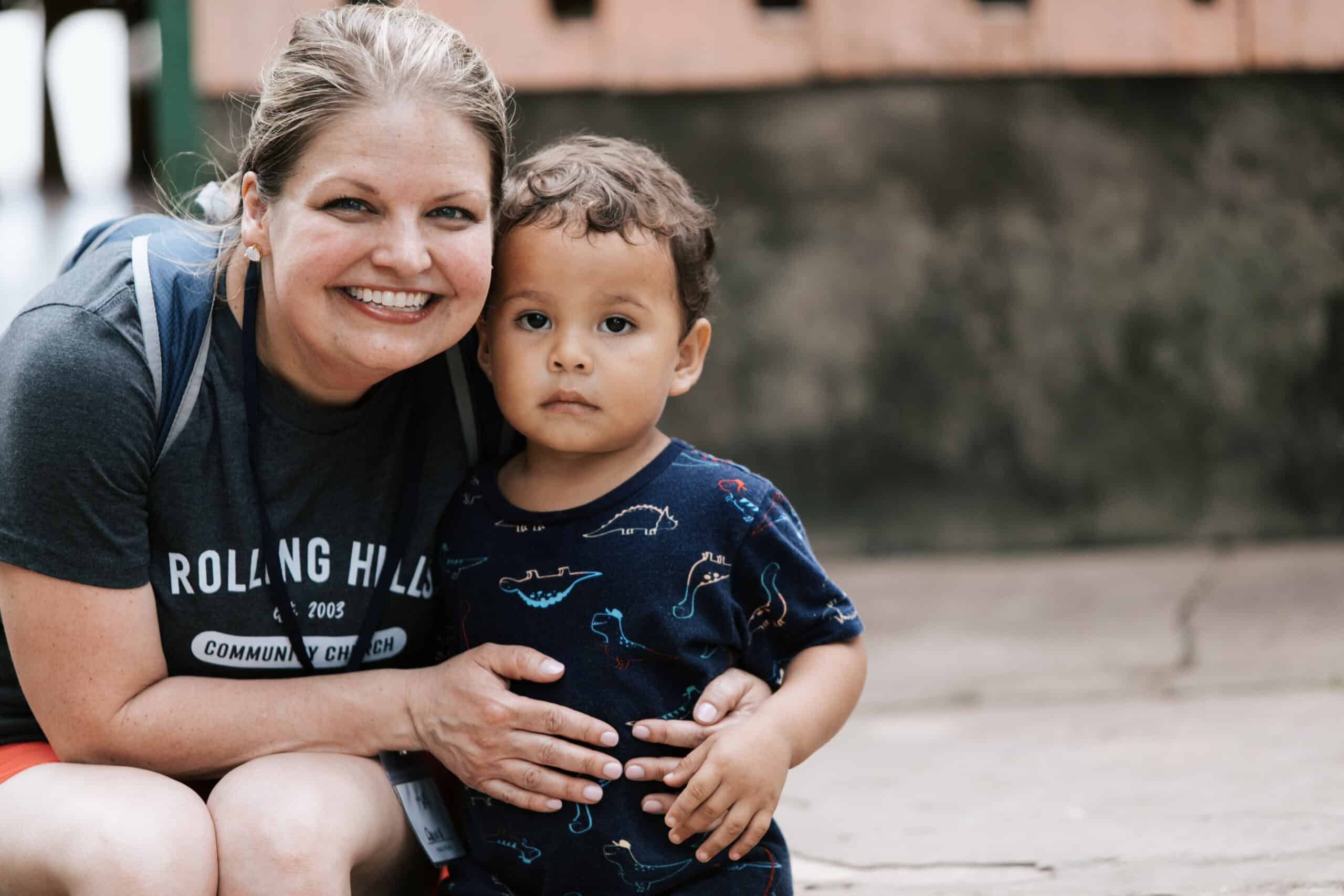 Woman and young boy at Rolling Hills Community Church outdoor event.
